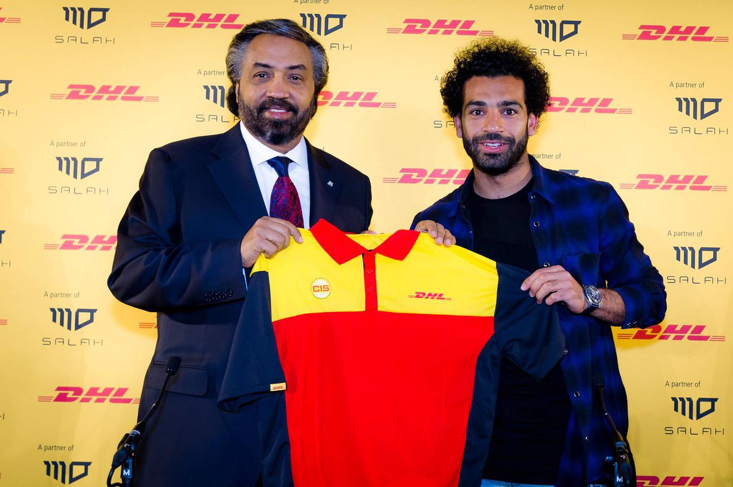 Liverpool and Egypt forward Mohamed Salah, right, and Nour Suliman, chief executive of DHL in the Middle East and North Africa. Courtesy DHL