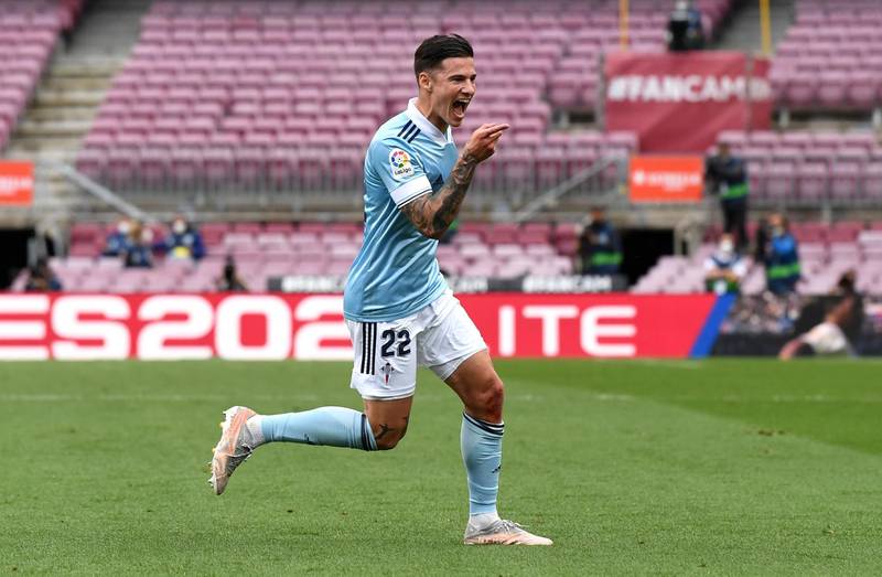 BARCELONA, SPAIN - MAY 16: Santi Mina of Celta Vigo celebrates after scoring their team's first goal  during the La Liga Santander match between FC Barcelona and RC Celta at Camp Nou on May 16, 2021 in Barcelona, Spain. Sporting stadiums around Spain remain under strict restrictions due to the Coronavirus Pandemic as Government social distancing laws prohibit fans inside venues resulting in games being played behind closed doors.  (Photo by David Ramos/Getty Images)