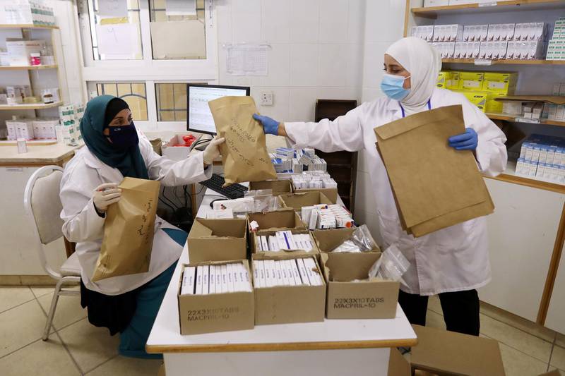 Members of the medical staff at UNRWA prepare prescription medicines to deliver to Palestinian refugees in their homes at Amman New camp amid concerns over the spread of the coronavirus in Amman, Jordan. REUTERS