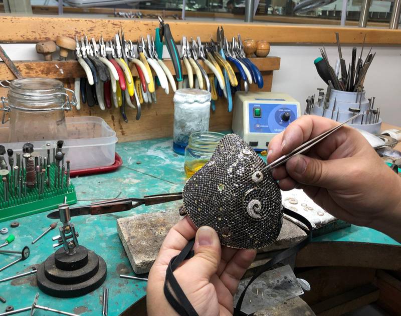 The diamond-encrusted face mask being assembled at the Yvel atelier in Israel. Courtesy Yvel