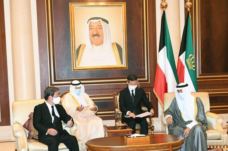 Japanese Foreign Minister Toshimitsu Motegi offers condolences on behalf of his government to Kuwait's new emir Sheikh Nawaf Al Sabah, at Kuwait international airport's emiri terminal in the capital. AFP