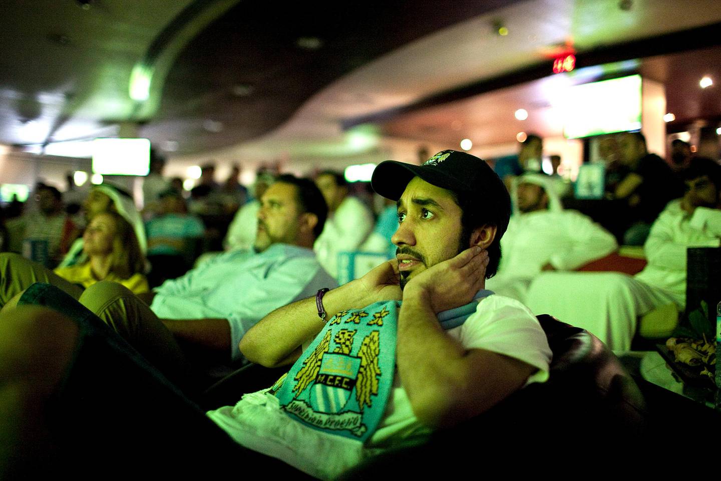  Abu Dhabi, United Arab Emirates, April 30, 2012:   
Othman Said Saif of Al Ain tensely follows the action on a TV screen as he and about hundred other fans gather to watch the Manchester United v Manchester City game on Monday, Apr. 30, 2012, at the Clubhouse at the Zayed Sports City in Abu Dhabi. Manchester City led the game after the fist half with a one-goal victory. (Silvia Razgova / The National)
