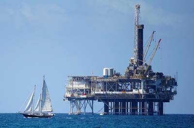 FILE PHOTO: An offshore oil platform is seen in Huntington Beach, California September 28, 2014. Brent oil prices fell more than $2 a barrel to less than $88 on Monday, its lowest since 2010, after key Middle East producers signalled they would keep output high even if that meant lower prices. Brent oil prices have tanked by nearly 25 percent since June as ample supply coincided with weak demand, raising the possibility that the Organization of the Petroleum Exporting countries could cut output.  Picture taken September 28, 2014. REUTERS/Lucy Nicholson/File Photo