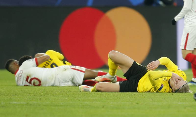 Borussia Dortmund's Erling Braut Haaland lays injured on the pitch. Reuters