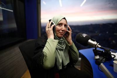 Iman Khatib Yasin, the first Muslim lawmaker in Israel's history to wear a head scarf, following results of her Arab Joint List party in Israel's election, participates in an interview in a radio show in Nazareth, Israel on March 5, 2020. Reuters