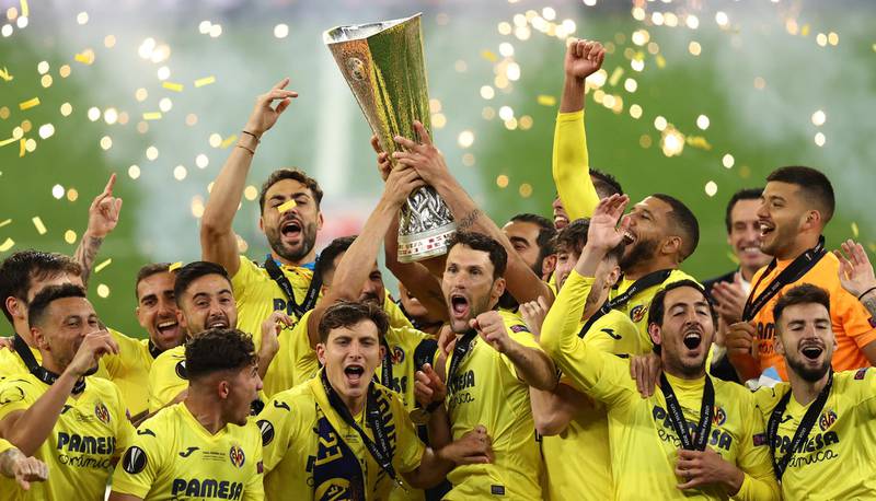 Villarreal players celebrate with the trophy after winning the Europa League final. EPA
