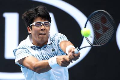 MELBOURNE, AUSTRALIA - JANUARY 17:  Hyeon Chung of Korea plays a backhand in his second round match against Pierre-Hugues Herbert of France during day four of the 2019 Australian Open at Melbourne Park on January 17, 2019 in Melbourne, Australia.  (Photo by Mark Kolbe/Getty Images)