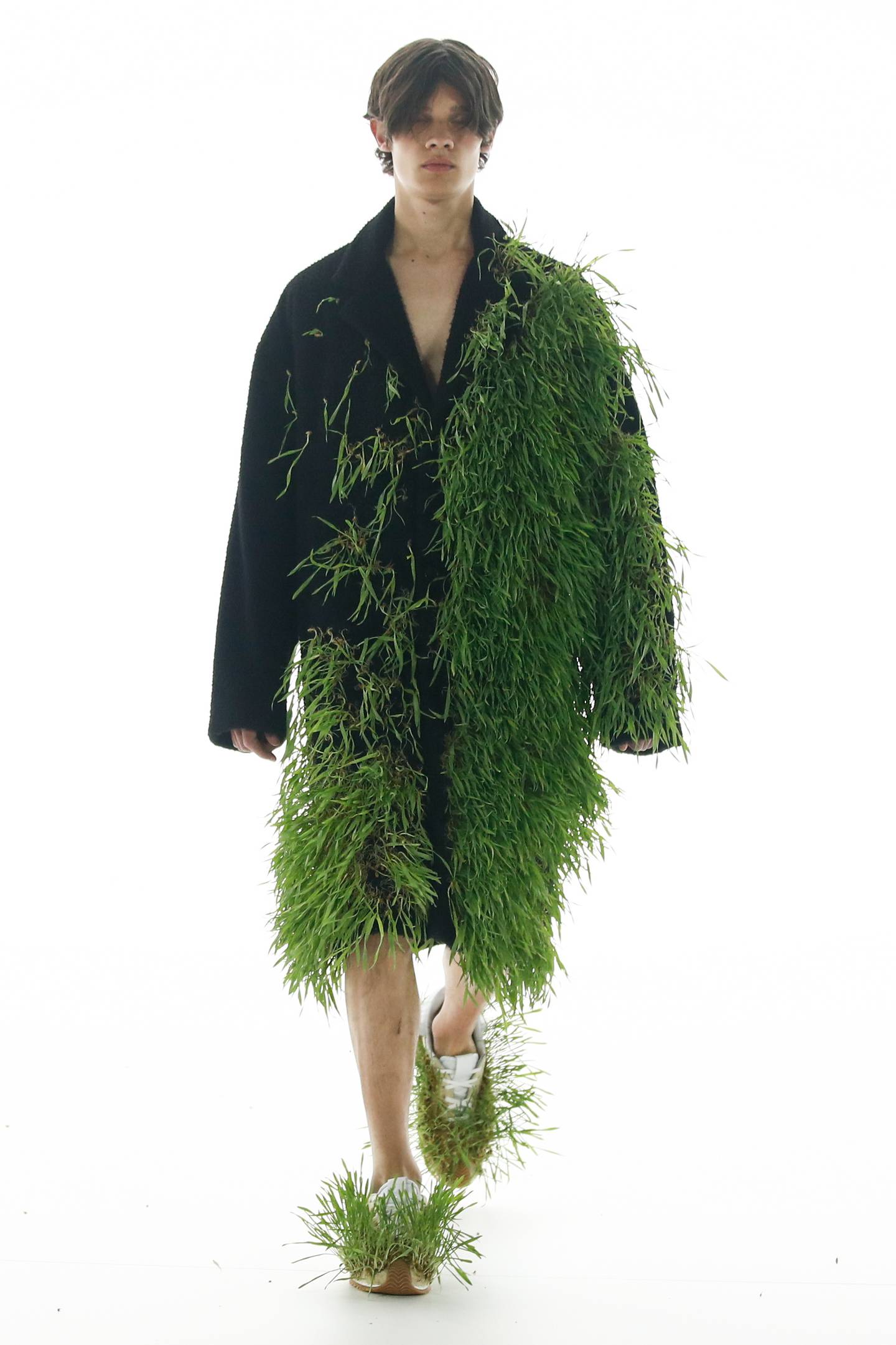 Grass featured prominently in British designer Jonathan William Anderson's spring/summer 2022-2023 men's collection for Loewe, seen during the Paris Fashion Week, on June 25, 2022. EPA