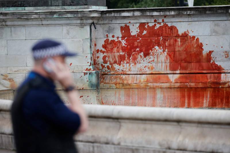 Red paint splashed over the Queen Victoria Memorial. AFP