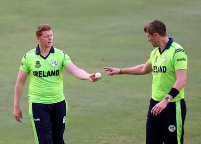 Dubai, United Arab Emirates - October 14, 2019: Ireland's Boyd Rankin and Kevin O'Brien (L) during the ICC Mens T20 World cup qualifier warm up game between the Ireland and The Netherlands. Monday the 14th of October 2019. International Cricket Stadium, Dubai. Chris Whiteoak / The National
