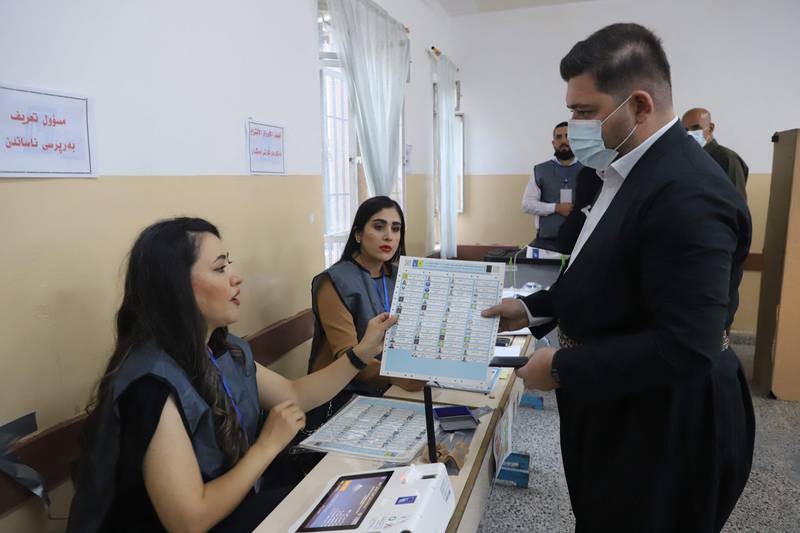 An Iraqi Kurdish voter registers to cast his vote in early parliamentary elections at a polling station in Sulaimaniyah, in Iraq’s northern Kurdish autonomous region. Photo: AFP