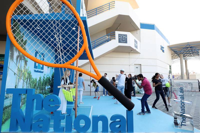 Abu Dhabi, United Arab Emirates - Reporter: Jon Turner: Fans enjoy The Nationals booth during the Mubadala World Tennis Championship. Friday, December 20th, 2019. Zayed Sports City, Abu Dhabi. Chris Whiteoak / The National