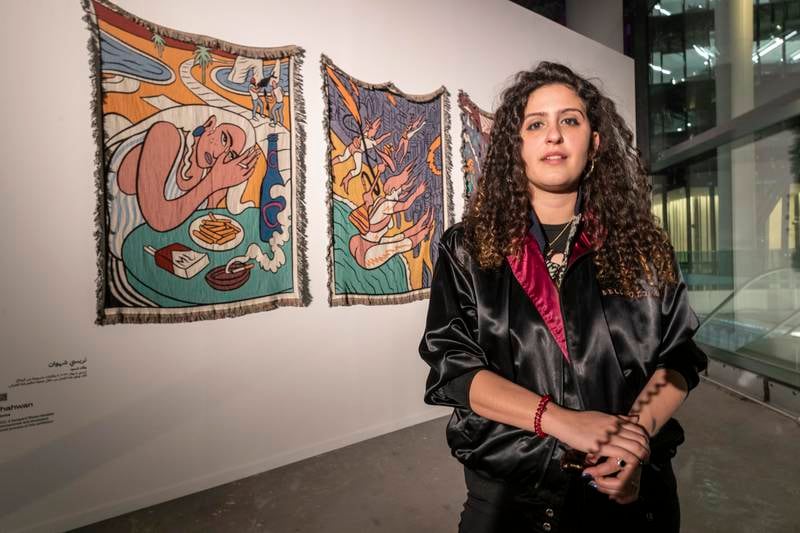 Tracy Chahwan with her artwork Resembling Resilience, a series of jacquard blankets. Antonie Robertson / The National