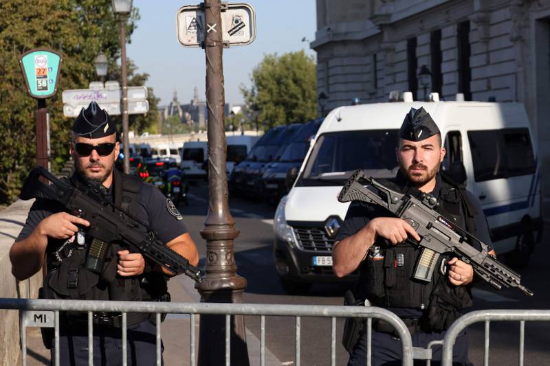 French Gendarmes stand guard outside the Palais de Justice in Paris. AFP