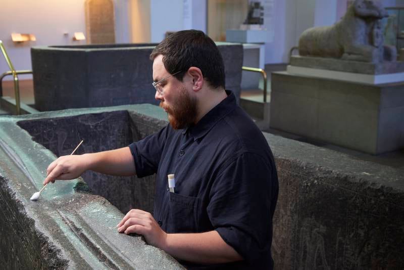 Mr Obana cleans ‘The Enchanted Basin’, which was later identified as the sarcophagus of Hapmen, a nobleman of the 26th Dynasty. Photo: The Trustees of the British Museum