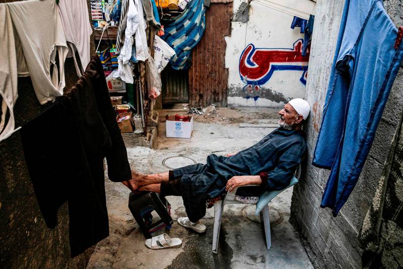 An elder Palestinian reclines his foot on a stool as he near his home at al-Shati camp for Palestinian refugees in the central Gaza Strip.  June 20 marks World Refugee Day, a day dedicated by the United Nations General Assembly to raising awareness of the situation of refugees throughout the world. Some five million individuals are refugees registered with the UN Relief and Works Agency for Palestine Refugees (UNRWA), of whom more than 1.5 million (nearly one-third) live in 58 recognised refugee camps in the Gaza Strip and the West Bank including East Jerusalem, in addition to Jordan, Lebanon, and Syria. Palestine refugees are defined by the UNRWA as "persons whose normal place of residence was Palestine during the period 1 June 1946 to 15 May 1948, and who lost both home and means of livelihood as a result of the 1948 conflict."  AFP