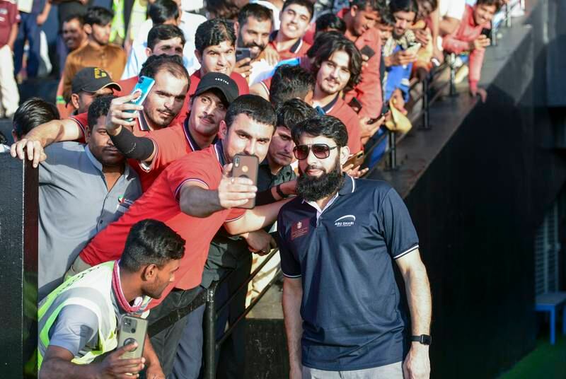 Misbah ul Haq poses for photos at Zayed Cricket Stadium.  Khushnum Bhandari / The National
