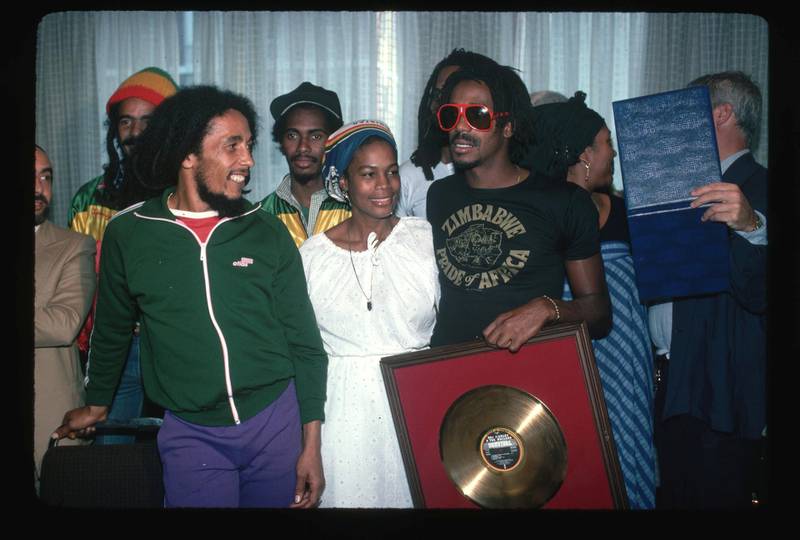 Bob Marley and Bunny Wailer receive a gold record for sales with their band the Wailers.   (Photo by Lynn Goldsmith/Corbis/VCG via Getty Images)