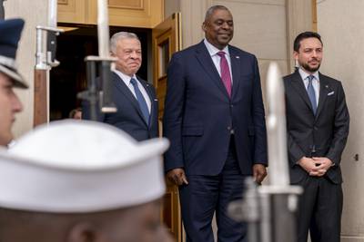 Secretary of Defense Lloyd Austin, centre, stands with King Abdullah II, left, and Crown Prince Hussein during a honour cordon at the Pentagon in Washington on May 12, 2022. AP Photo