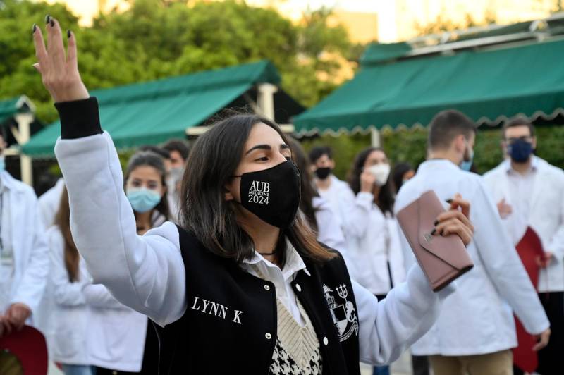 Medical students at the American University of Beirut (AUB) shout slogans during a protest against the adjustment of the dollar rate for new tuition fees in Beirut, Lebanon. EPA