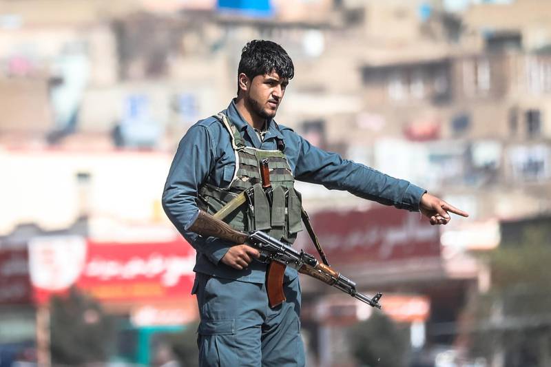An Afghan security official inspects the scene in the aftermath of a bomb explosion in Kabul, Afghanistan, on 18 March 2021. Hedayatullah Amid / EPA