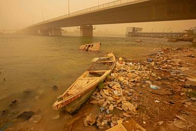 A boat beneath the bridge during the sandstorm.