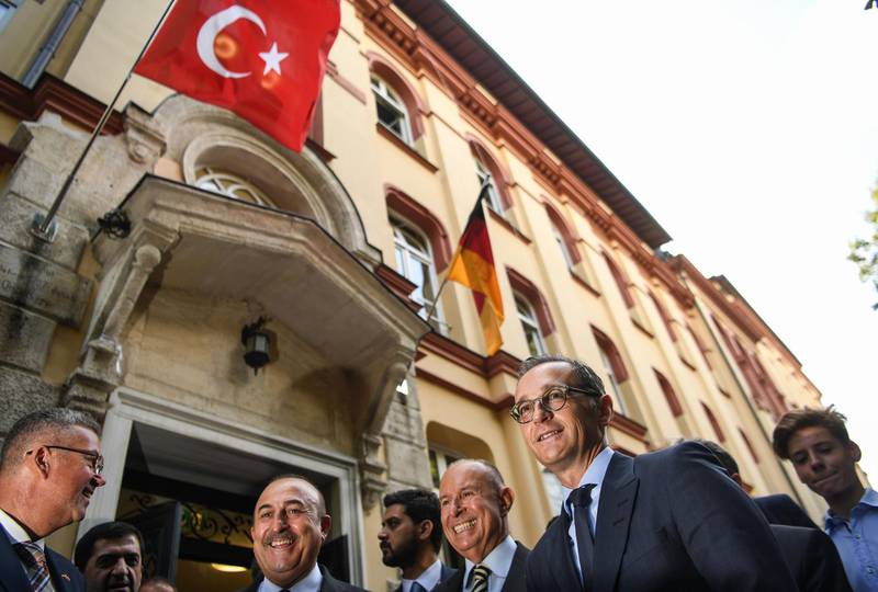 German foreign minister Heiko Maas and Turkish Foreign minister Mevlut Cavusoglu  stand in front of a German school in Istanbul. AFP