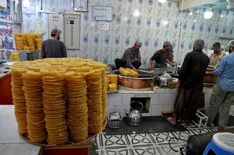 Workers fry sweets at a traditional confectionery shop in the Afghan capital Kabul. AFP