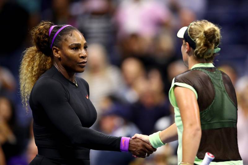 Serena Williams shakes hands with Catherine McNally following her 5-7, 6-3, 6-1 victory. AFP