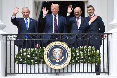 Sheikh Abdullah and, from left, Mr Netanyahu, Mr Trump and Mr Al Zayani wave from the Truman Balcony at the White House. AFP