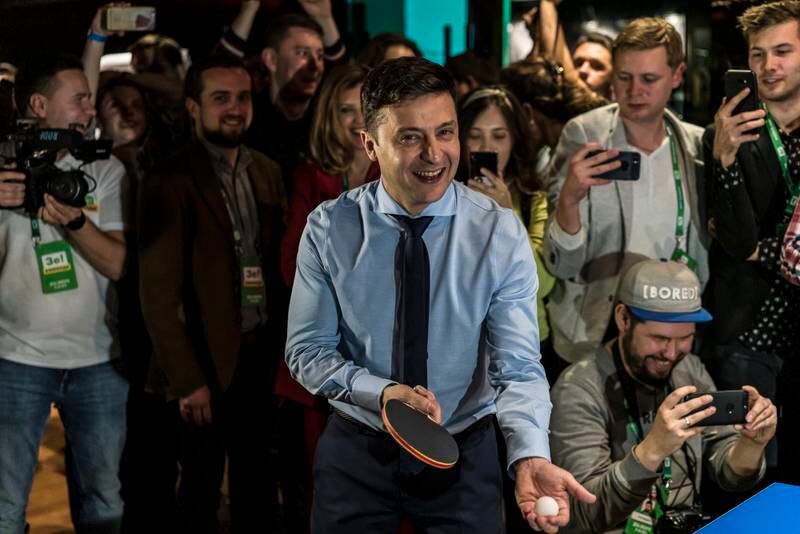 Playing table tennis with a journalist at his election night gathering in March 2019 in Kyiv. Getty Images