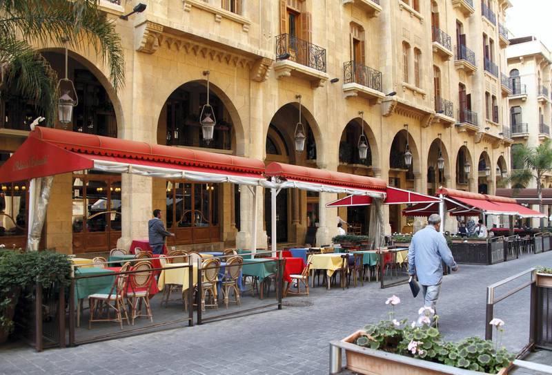 People walk past empty restaurants in downtown Beirut November 20, 2012. In addition to tumbling exports, Lebanon's tourist industry has declined by as much as 15 percent. Most Gulf countries warned their citizens this year not to visit Lebanon after clashes erupted between supporters and opponents of the Syrian uprising. Lebanon has also lost most of the 600,000 Arab tourists who usually drive into Lebanon through Syria each year. To match Reuters Summit MIDEAST-SUMMIT/LEBANON-SYRIA  REUTERS/Mohamed Azakir  (LEBANON - Tags: BUSINESS FOOD TRAVEL) - GM1E8BK1SFV01