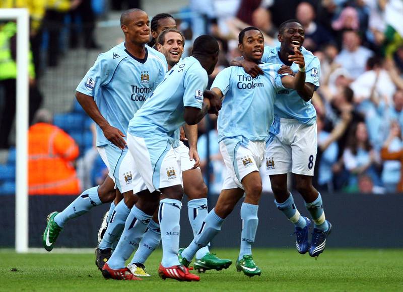 MANCHESTER, UNITED KINGDOM - SEPTEMBER 13:  Robinho of Manchester is mobbed by team mates after scoring the first goal of the game during the Barclays Premier League match between Manchester City and Chelsea at The City of Manchester Stadium on September 13, 2008 in Manchester, England.  (Photo by Alex Livesey/Getty Images)