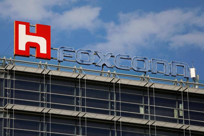 FILE PHOTO: The logo of Foxconn, the trading name of Hon Hai Precision Industry, is seen on top of the company's building in Taipei, Taiwan March 30, 2018. REUTERS/Tyrone Siu/File Photo