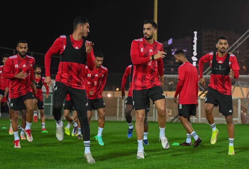 Khalil Ibrahim, left, and Majed Hassan, right, warm up for the training session. Photo: UAE FA
