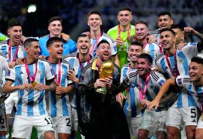 Argentina captain Lionel Messi celebrates with World Cup trophy. PA