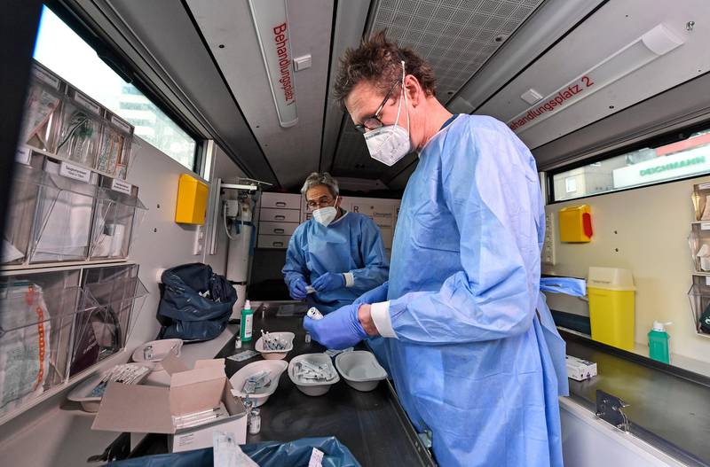 Medical staff prepare Moderna vaccinations in a mobile centre in Cologne, Germany. AP Photo
