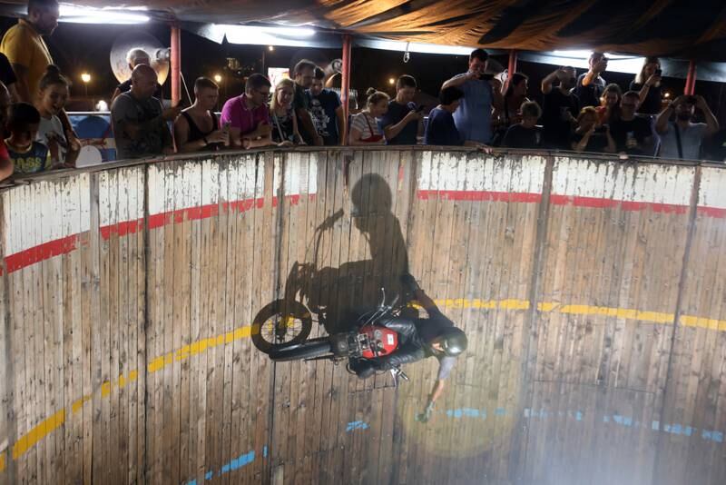 Motorcycle driver Zoran Milojkovic performs his stunt at the 'Bozo Vukadinovic' wall of death in Belgrade, Serbia. EPA