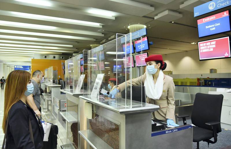 Protective barriers have been installed at Dubai International Airport at each check-in desk and immigration counter to provide additional safety reassurance to passengers and employees during interaction over the counter. Courtesy Emirates 