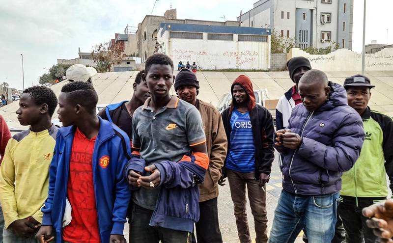 Day labourers seeking small jobs wait under a bridge in the Libyan capital Tripoli to be hired for casual work. Driven from home by desperation and warded off European shores, hundreds of migrants from sub-Saharan Africa are resigned to staying in the conflict-hit country. AFP