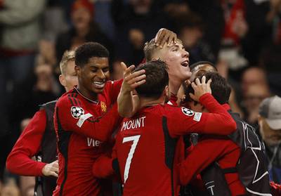 Manchester United's Rasmus Hojlund celebrates scoring the second goal with teammates. Reuters