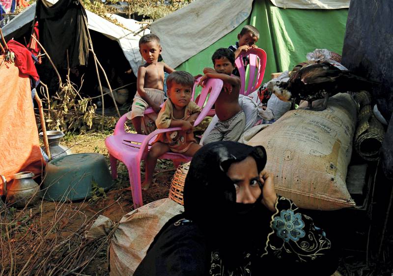 Rohingya people rest at a makeshift shelter in No Man’s Land after crossing the Bangladesh-Myanmar border fence, in Cox’s Bazar, Bangladesh, August 29, 2017. REUTERS/Mohammad Ponir Hossain