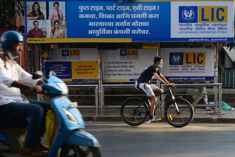 An advertisement for Life Insurance Corporation at a bus shelter in Mumbai. The initial public offering of the country's biggest life insurer is expected to raise up to $2.7 billion. AFP