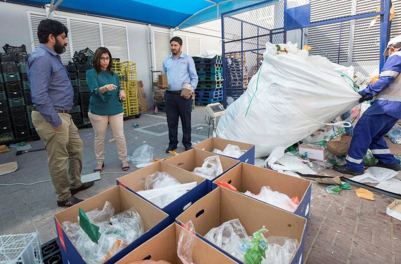 Dubai, United Arab Emirates - Workers placing plastic and papers at this area at kibsons HQ, Dubai. Ruel Pableo for The National