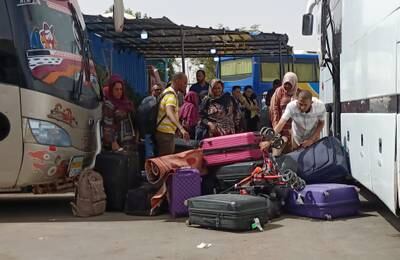 Passengers fleeing the fighting in Sudan arrive at Wadi Karkar bus station in Aswan, Egypt. EPA