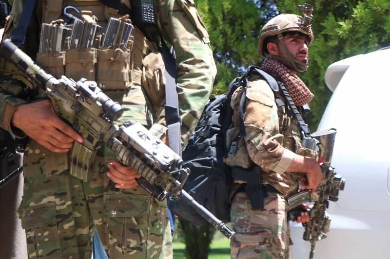 Afghan security officials arrive as part of a reinforcement to fight against Taliban militants as they push to gain access to the city in Herat.