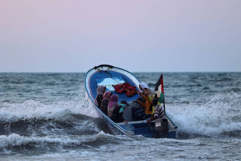 Palestinians in a boat near the beach in Gaza City. AFP