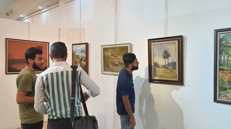 Paintings on display at the annual Iraqi Landscape Exhibition.