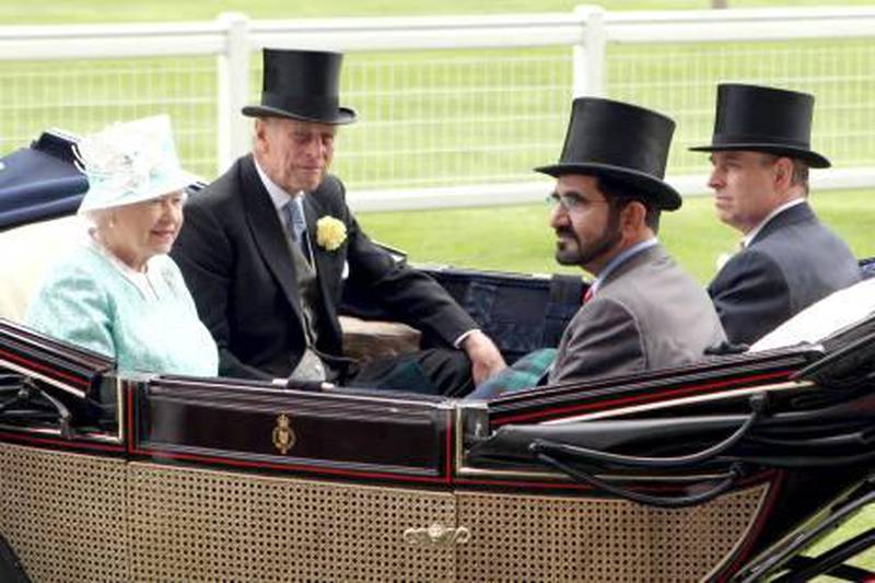 UK, ASCOT, June 18, 2009: (Left-right) Britain's Queen Elizabeth II, her husband The Duke of Edinburgh, HH Sheikh Mohammed bin Rashid Al Maktoum, Vice President & Prime Mininster of the UAE & Ruler of Dubai, and Prince Andrew, as they arrive for the days' racing during Ladies Day, the third day of Royal Ascot, in Berkshire, west of London, on June 18, 2009. The five-day meeting is one of the highlights of the horse racing calendar. Horse racing has been held at the famous Berkshire course since 1711 and tradition is a hallmark of the meeting. Top hats and tails remain compulsory in parts of the course while a daily procession of horse-drawn carriages brings the Queen to the course. WAM *** Local Caption ***  wam80 18-06-09.jpg