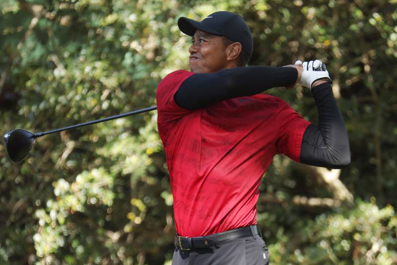 Woods plays a shot at Augusta.  Getty / AFP